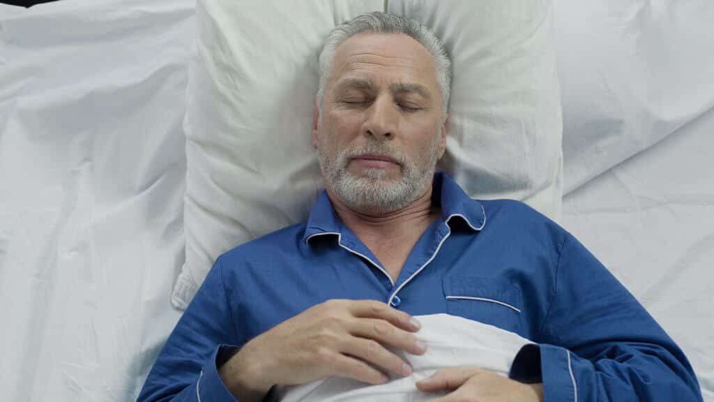 Old Man Sleeping Peacefully after Sleep Apnea Treatment